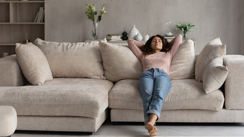 Woman relaxing on couch