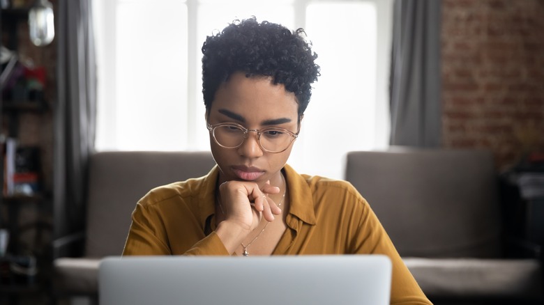 Woman researching on laptop