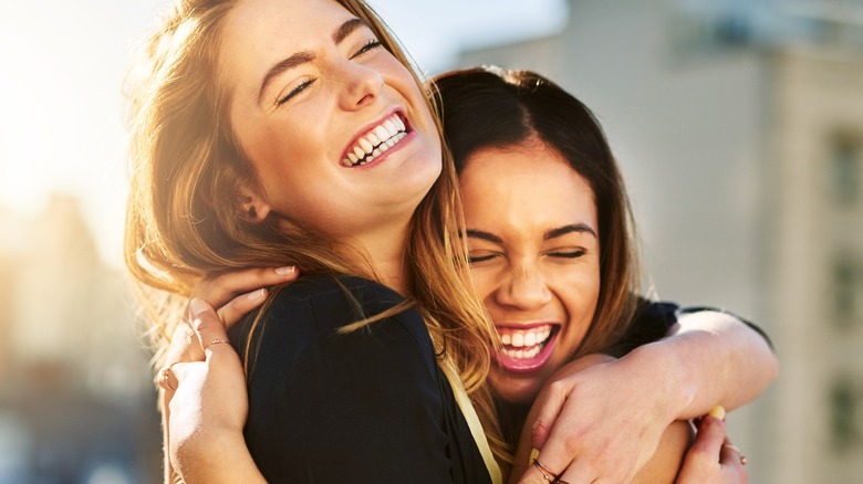 two female friends hugging