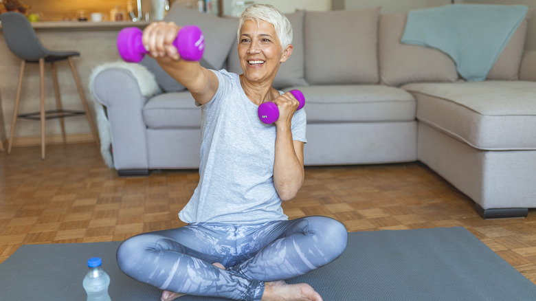 Woman using hand weights 