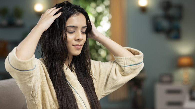 woman combing hair with fingers