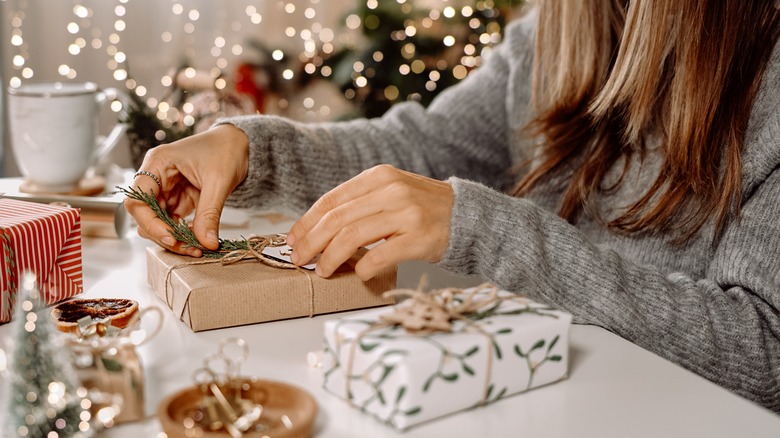 Woman wraps personalized gifts