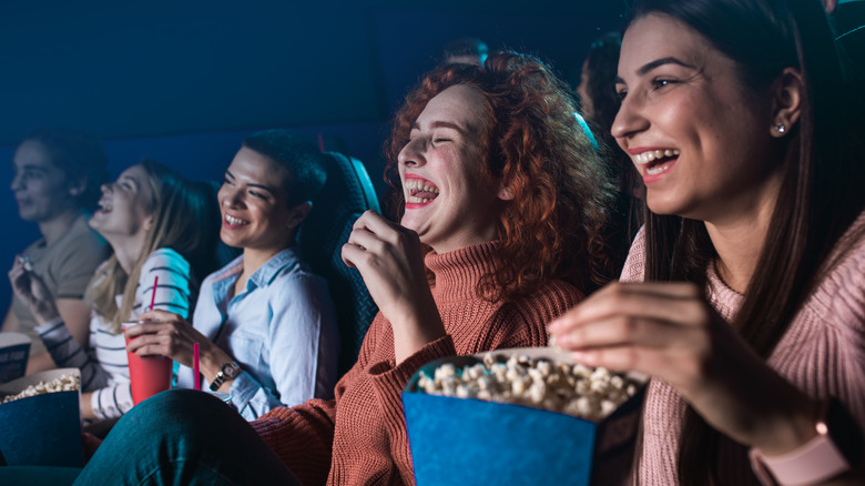 Friends watching movie in theater