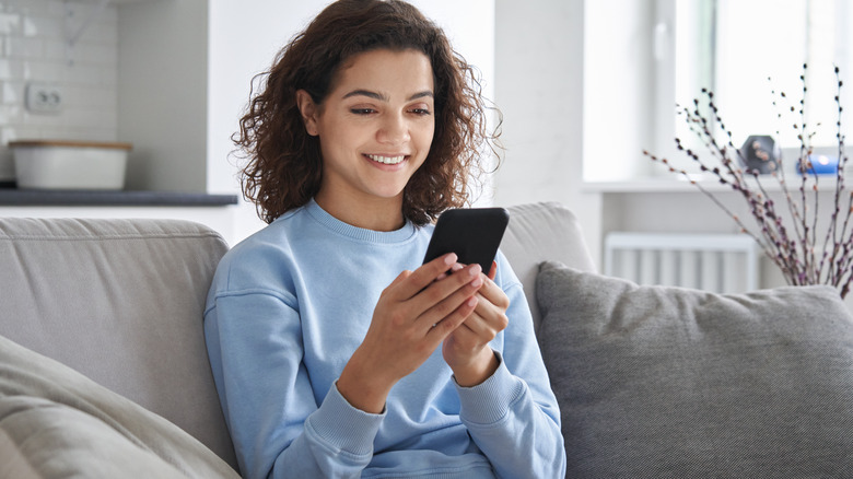 Woman takes notes on phone