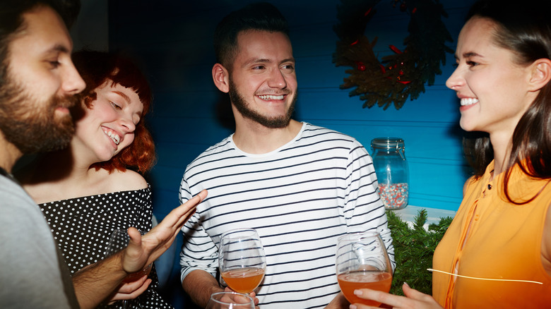 group of friends smiling and drinking