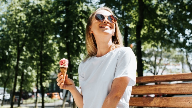 Woman eating ice cream outside