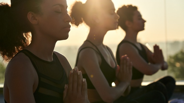 Women sitting in yoga pose