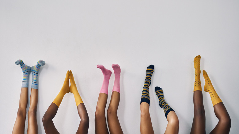group of womens feet with socks