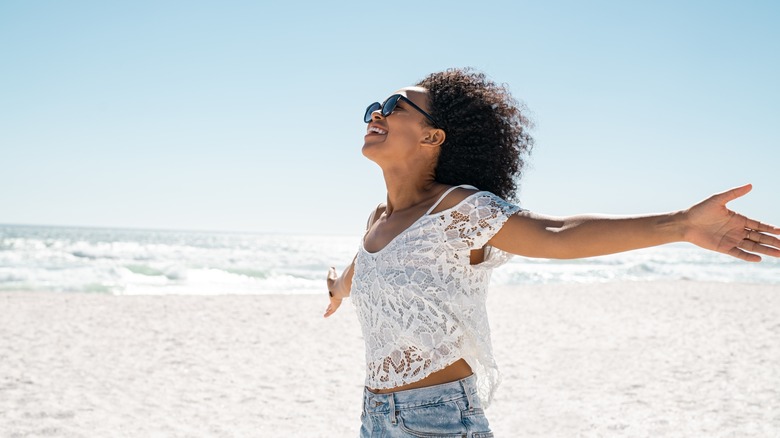 Woman in sunglasses on beach