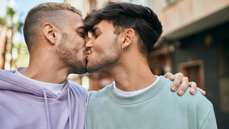 Couple kissing affectionately 