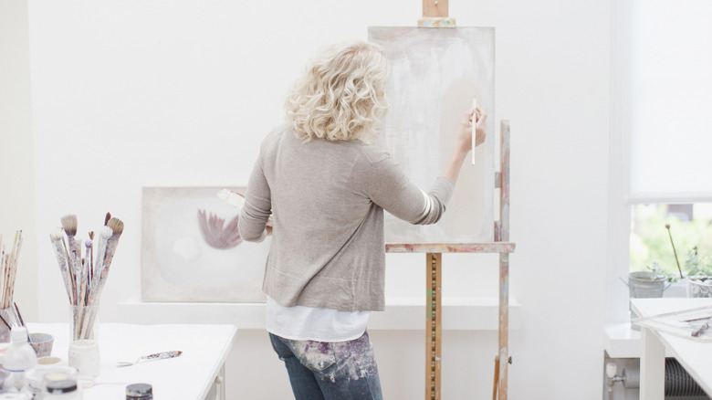blonde woman painting 