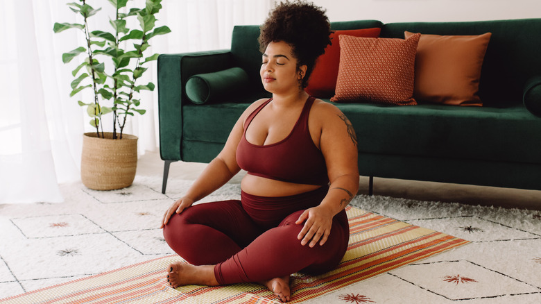 Body positive woman doing yoga 