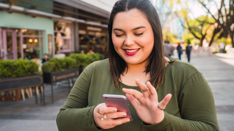 Woman scrolling on her phone 