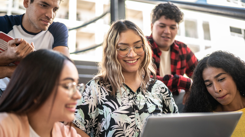 students with laptop