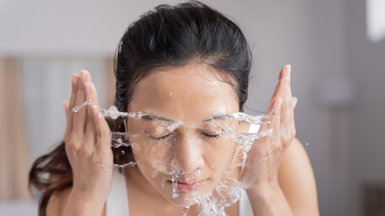 woman washing face