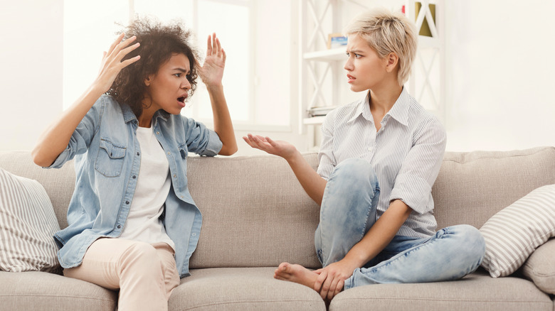 Woman looks unhappy during group gathering 