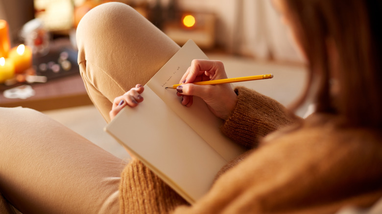 Woman writes in journal