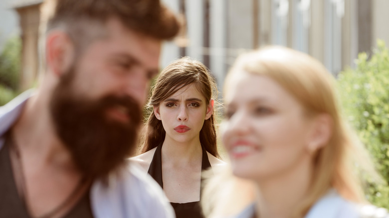 jealous woman and couple