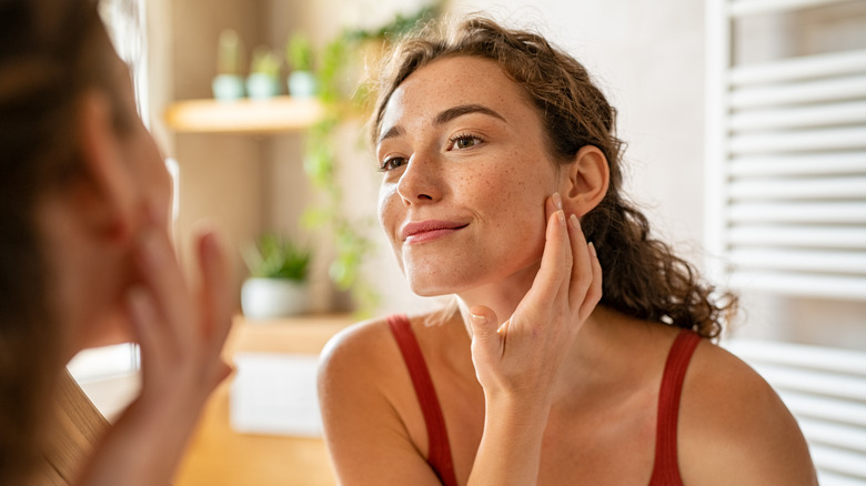 woman applying skincare