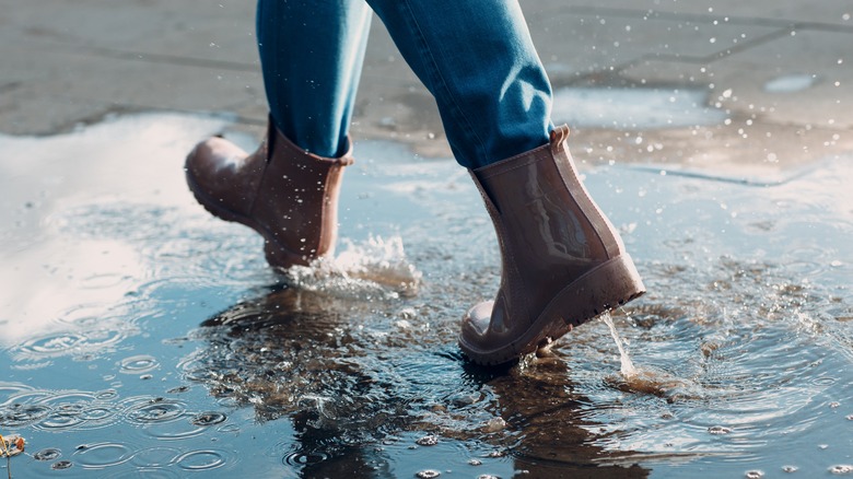 stepping in a puddle with boots