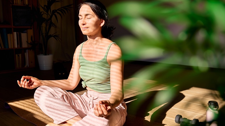 Woman meditating eyes closed