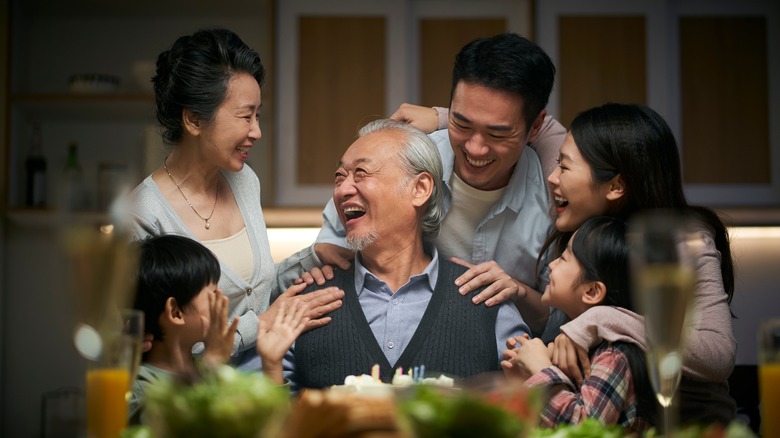 family talking smiling at each other 