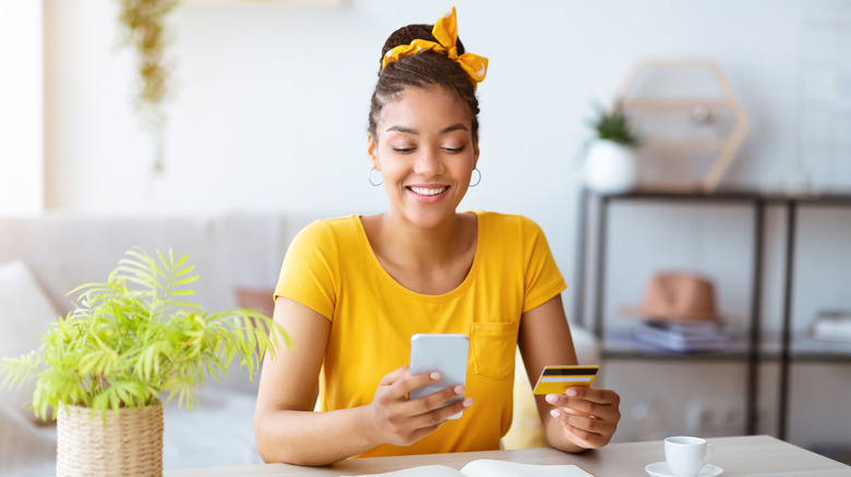 woman holding credit card