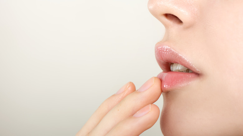 person applying lip primer