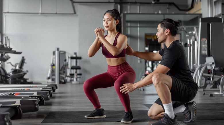 Woman with personal trainer