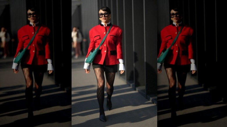 woman wearing jacket and skirt with Gucci tights