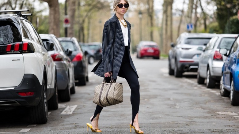 Woman wearing oversized pinstriped blazer