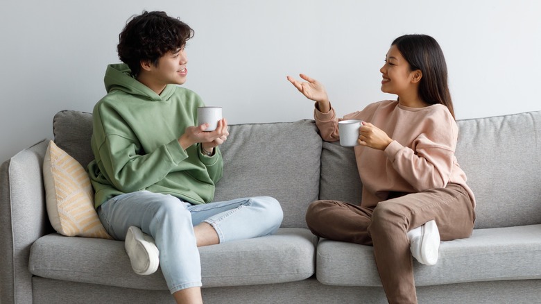 couple talking on a couch