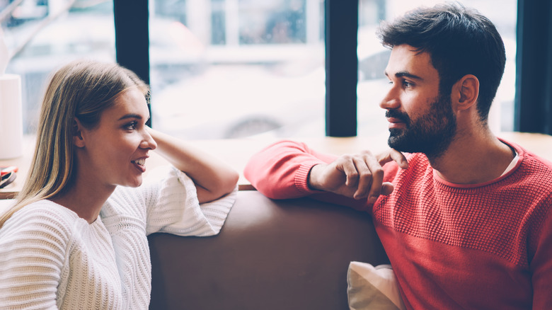 man and woman talking