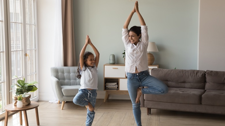 Mother and daughter practicing yoga
