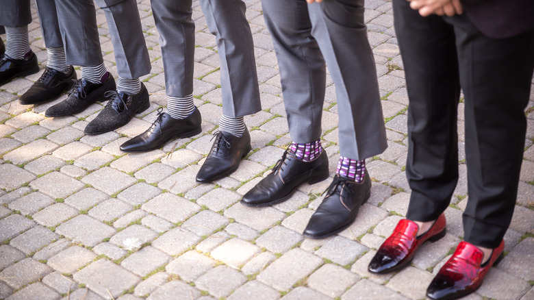 groomsmen in different shoes and socks