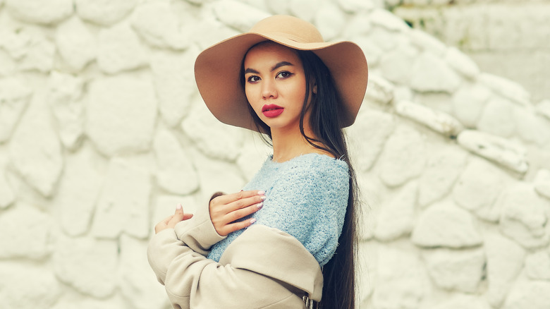 Woman wearing floppy felt hat