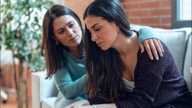 Woman comforting other woman