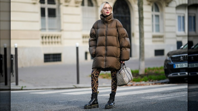 Woman in puffer coat with leggings