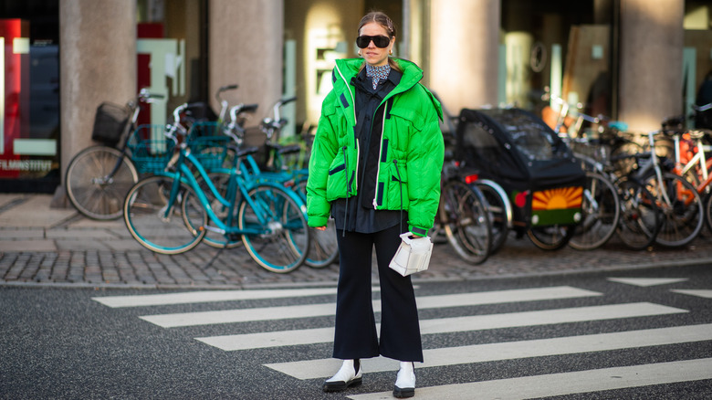 Woman wearing neon puffer coat