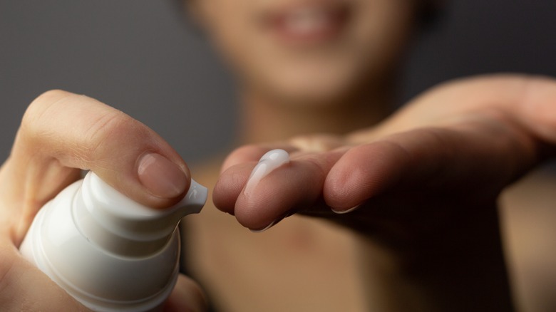 woman applying pea-sized amount of product