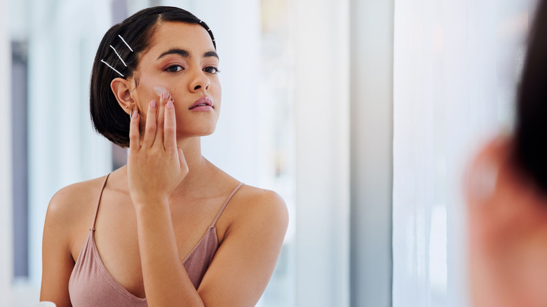 woman applying face cream