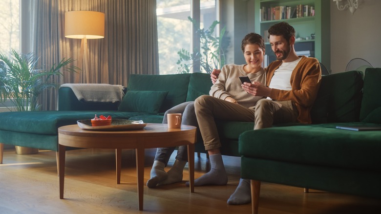 Couple on sofa with phone