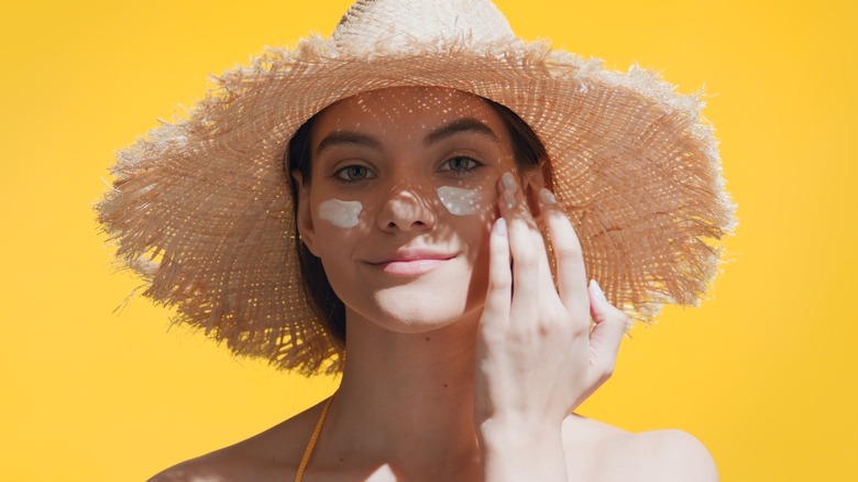 Woman applying SPF