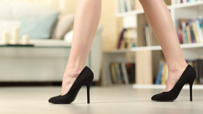 Woman walking in heels at home
