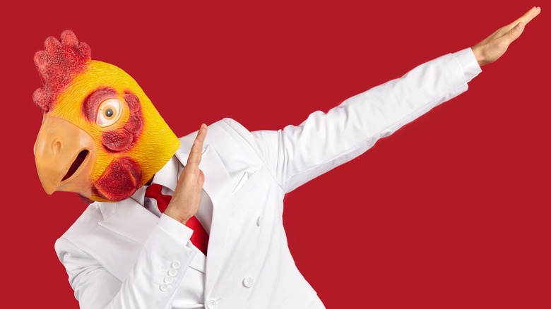 man in chicken mask