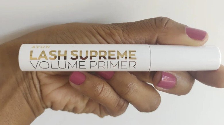 Person holding lash primer