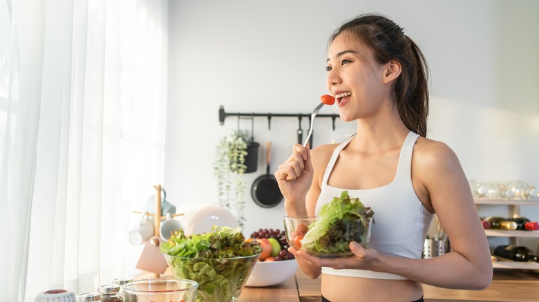 woman eating salad