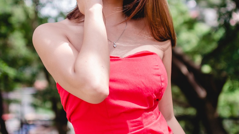 girl in a red strapless top