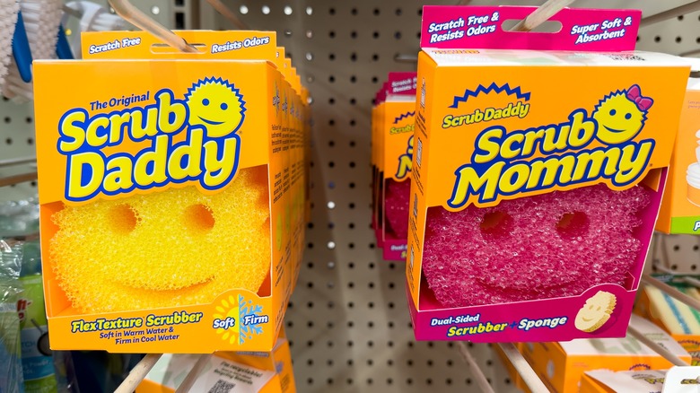 yellow scrub daddy sold next to pink scrub mommy