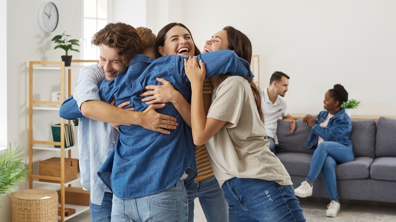 Group of friends hugging 